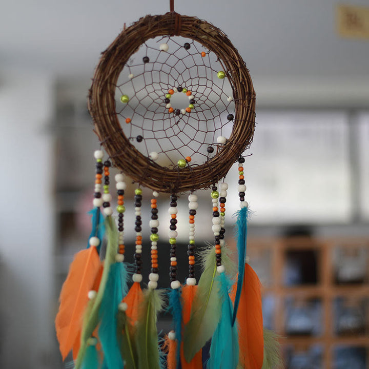 Attrape-rêves Olivenorma en rotin, plumes et perles mélangées, style bohème, symbole de la nature - image 4