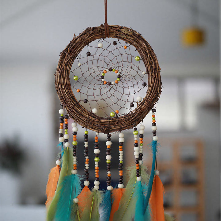 Attrape-rêves Olivenorma en rotin, plumes et perles mélangées, style bohème, symbole de la nature - image 5