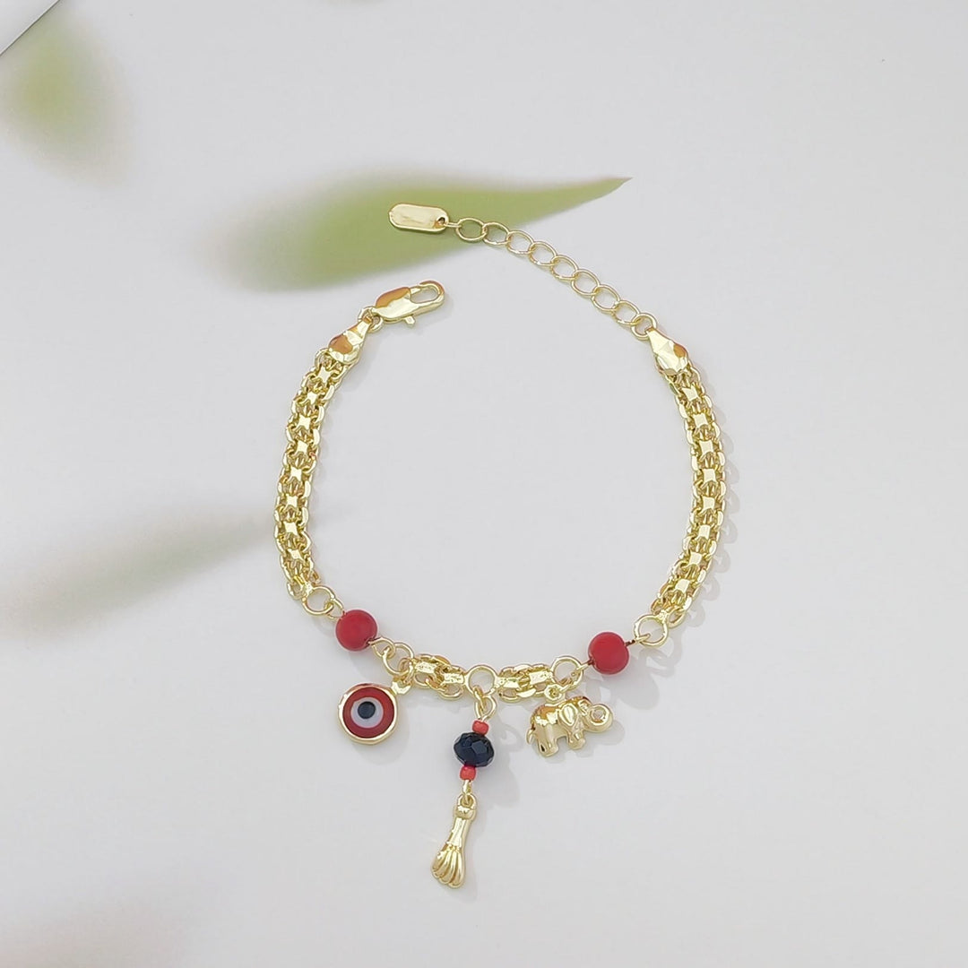 Bracelet Olivenorma en cuivre avec breloque œil protecteur et éléphant, symbole de protection et de bénédiction, orné d'un œil protecteur. - Perle rouge - image 2