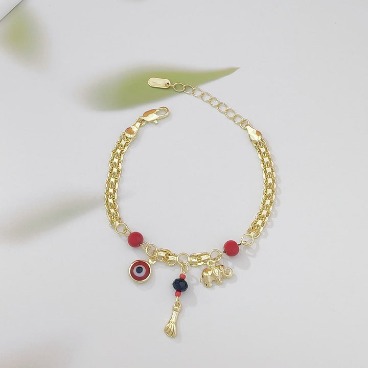 Bracelet Olivenorma en cuivre avec breloque œil protecteur et éléphant, symbole de protection et de bénédiction, orné d'un œil protecteur. - Perle rouge - image 2