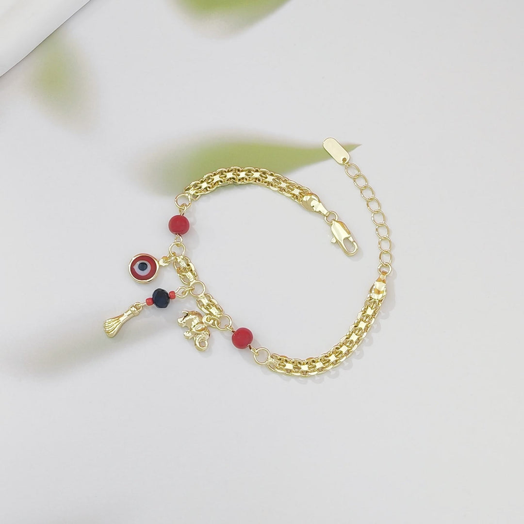 Bracelet Olivenorma en cuivre avec breloque œil protecteur et éléphant, symbole de protection et de bénédiction, orné d'un œil protecteur. - image 5