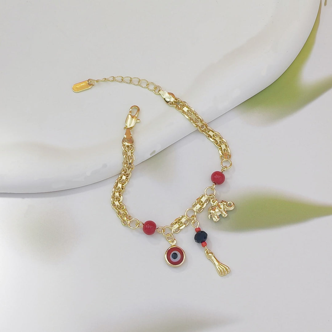 Bracelet Olivenorma en cuivre avec breloque œil protecteur et éléphant, symbole de protection et de bénédiction, orné d'un œil protecteur. - image 6