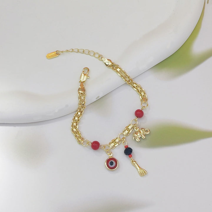 Bracelet Olivenorma en cuivre avec breloque œil protecteur et éléphant, symbole de protection et de bénédiction, orné d'un œil protecteur. - image 6
