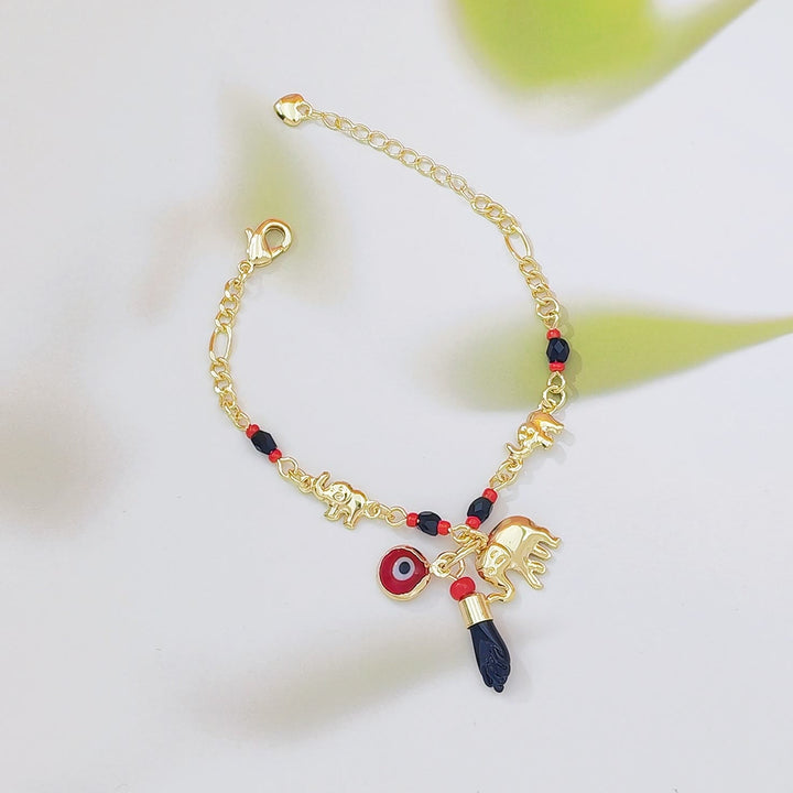 Bracelet Olivenorma en cuivre avec pendentif œil protecteur et perles, symbole de protection. - Pour enfant - image 1