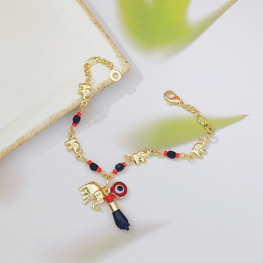 Bracelet Olivenorma en cuivre avec pendentif œil protecteur et perles, symbole de protection. - image 3