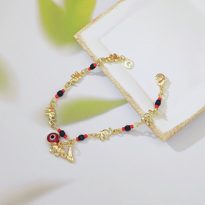 Bracelet Olivenorma en cuivre avec pendentif œil protecteur et perles, symbole de protection. - Pour adulte B - image 2
