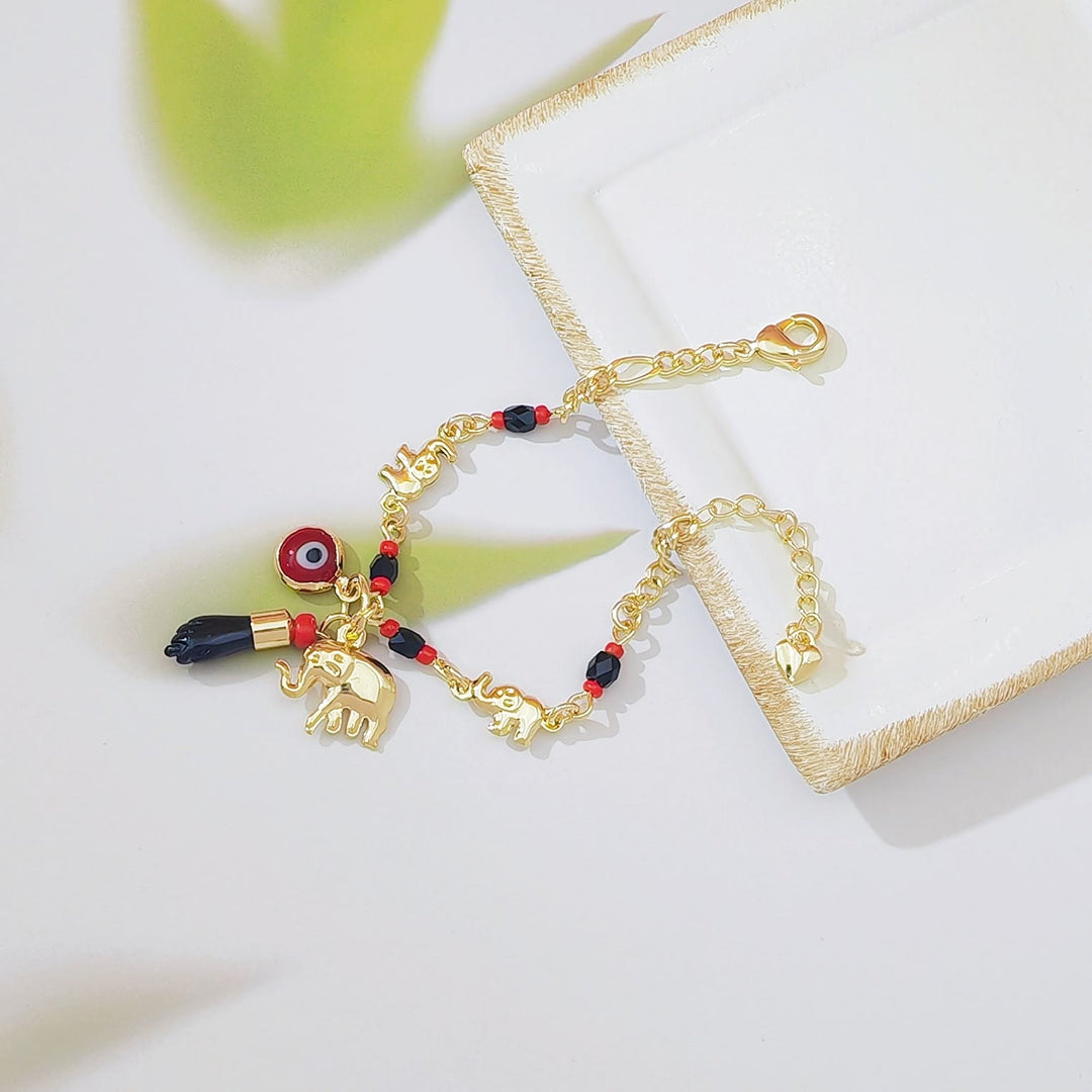 Bracelet Olivenorma en cuivre avec pendentif œil protecteur et perles, symbole de protection. - image 4