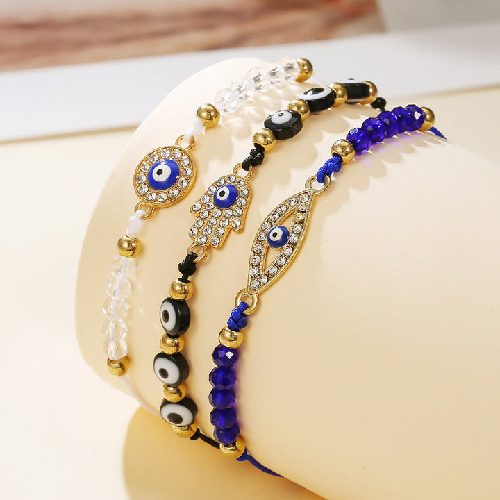 Bracelet Olivenorma en cuivre avec breloque œil protecteur et formes multiples - Noir, bleu et blanc - image 0