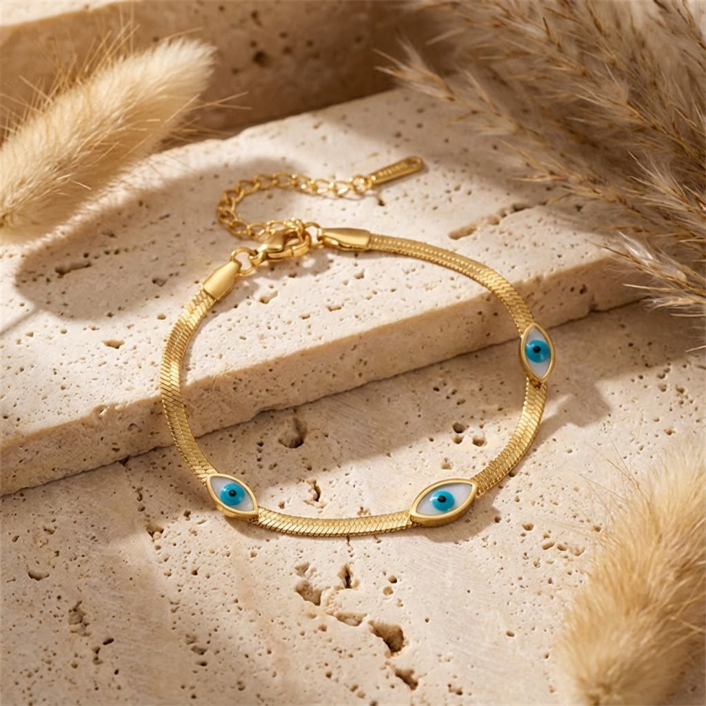 Bracelet Olivenorma en acier inoxydable avec triple œil protecteur et chaîne serpent. - image 1