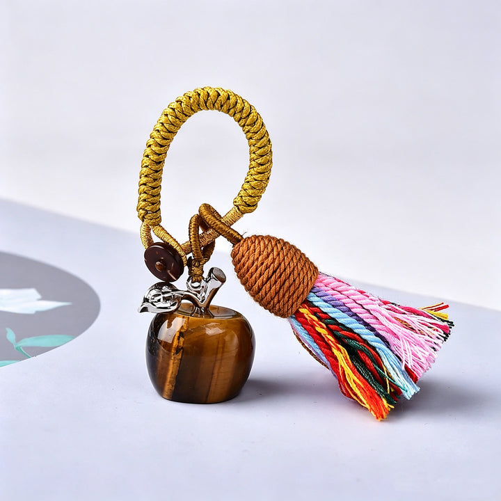 Porte-clés Olivenorma en cristal, motif pomme et pompon, symbole de bénédiction - Œil de tigre - image 3