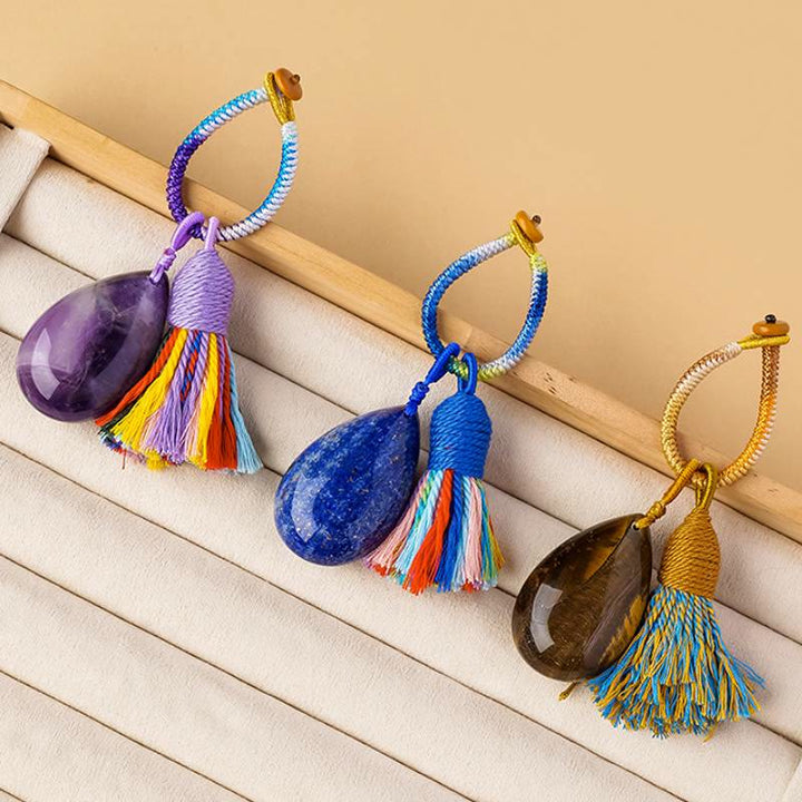 Porte-clés Olivenorma en cristal naturel, pompon en forme de larme, tissé à la main, symbole de protection et de bénédiction. - image 0