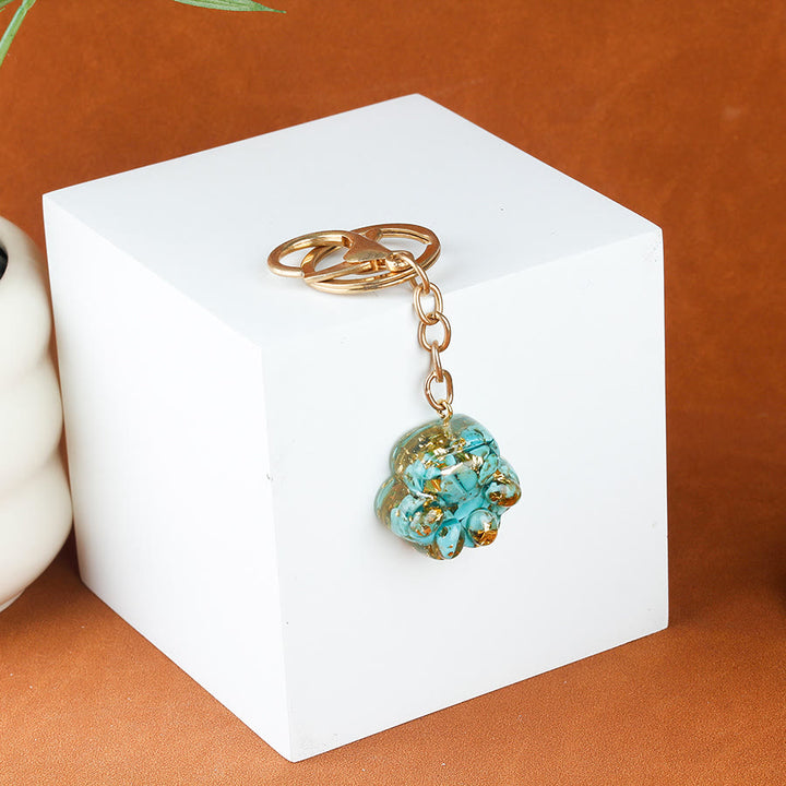 Porte-clés porte-bonheur Olivenorma en résine cristal naturelle et forme de patte de chat, chaîne dorée - Turquoise - image 1
