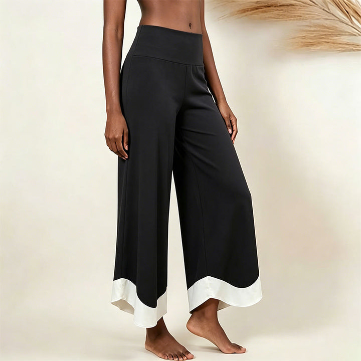 Pantalon de yoga court taille haute Olivenorma, couleur unie et extensible, idéal pour le sport et la détente. Coupe évasée. - Noir et blanc assemblé - L - image 13
