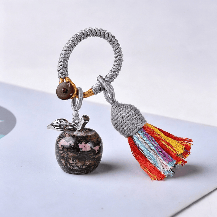 Porte-clés Olivenorma en cristal, motif pomme et pompon, symbole de bénédiction - Rhodonite - image 30