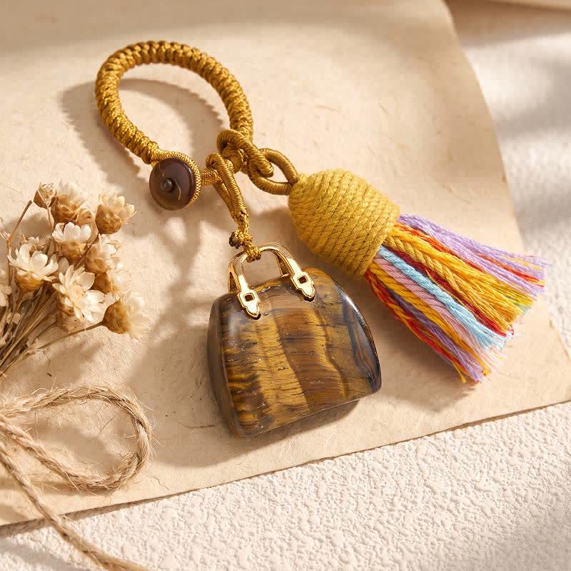 Porte-clés Olivenorma en cristal naturel, en forme de sac à main, avec pompon tressé et symbole de prospérité - Œil de tigre - image 1