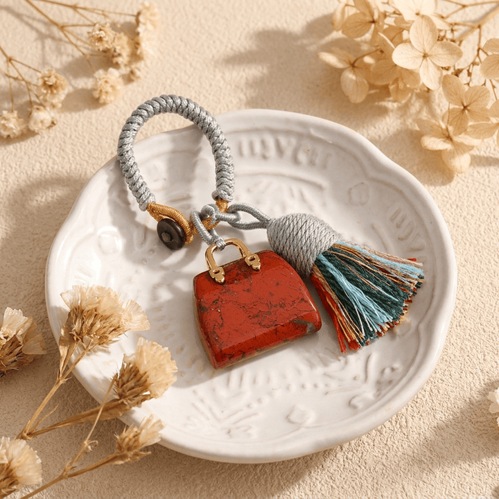 Porte-clés Olivenorma en cristal naturel, en forme de sac à main, avec pompon tressé et symbole de prospérité - Jaspe rouge - image 13