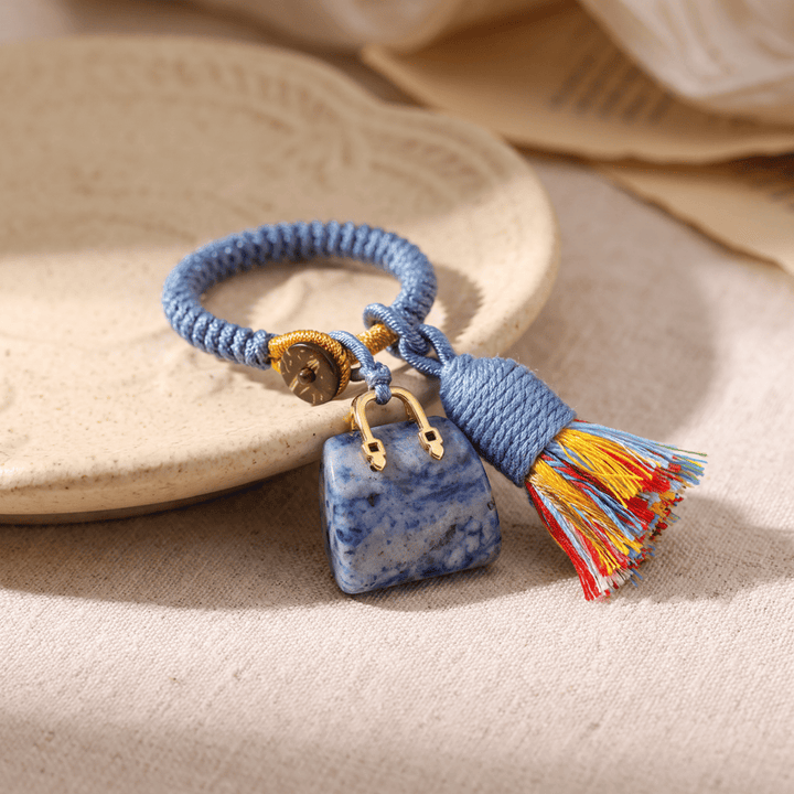 Porte-clés Olivenorma en cristal naturel, en forme de sac à main, avec pompon tressé et symbole de prospérité - Sodalite - image 34