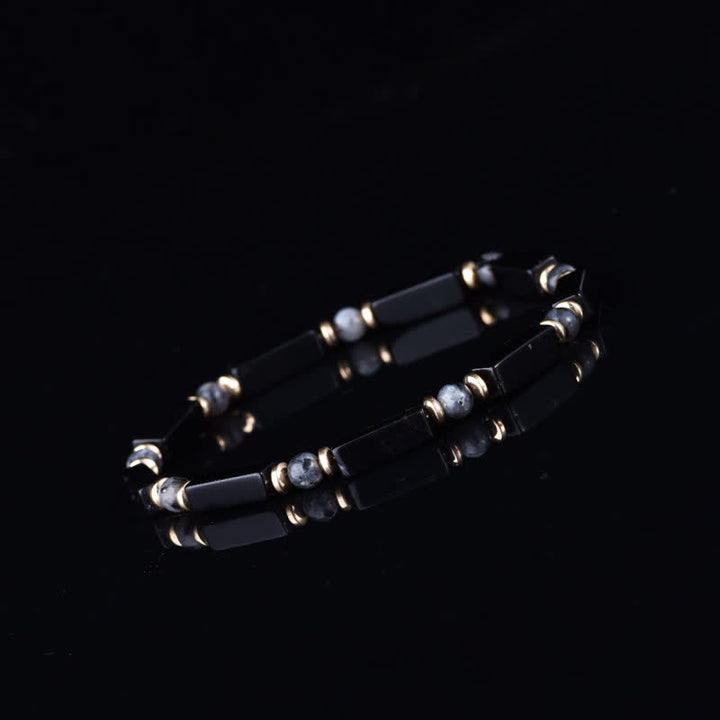 Bracelet Olivenorma en pierres naturelles avec perles et symbole de protection - image 2