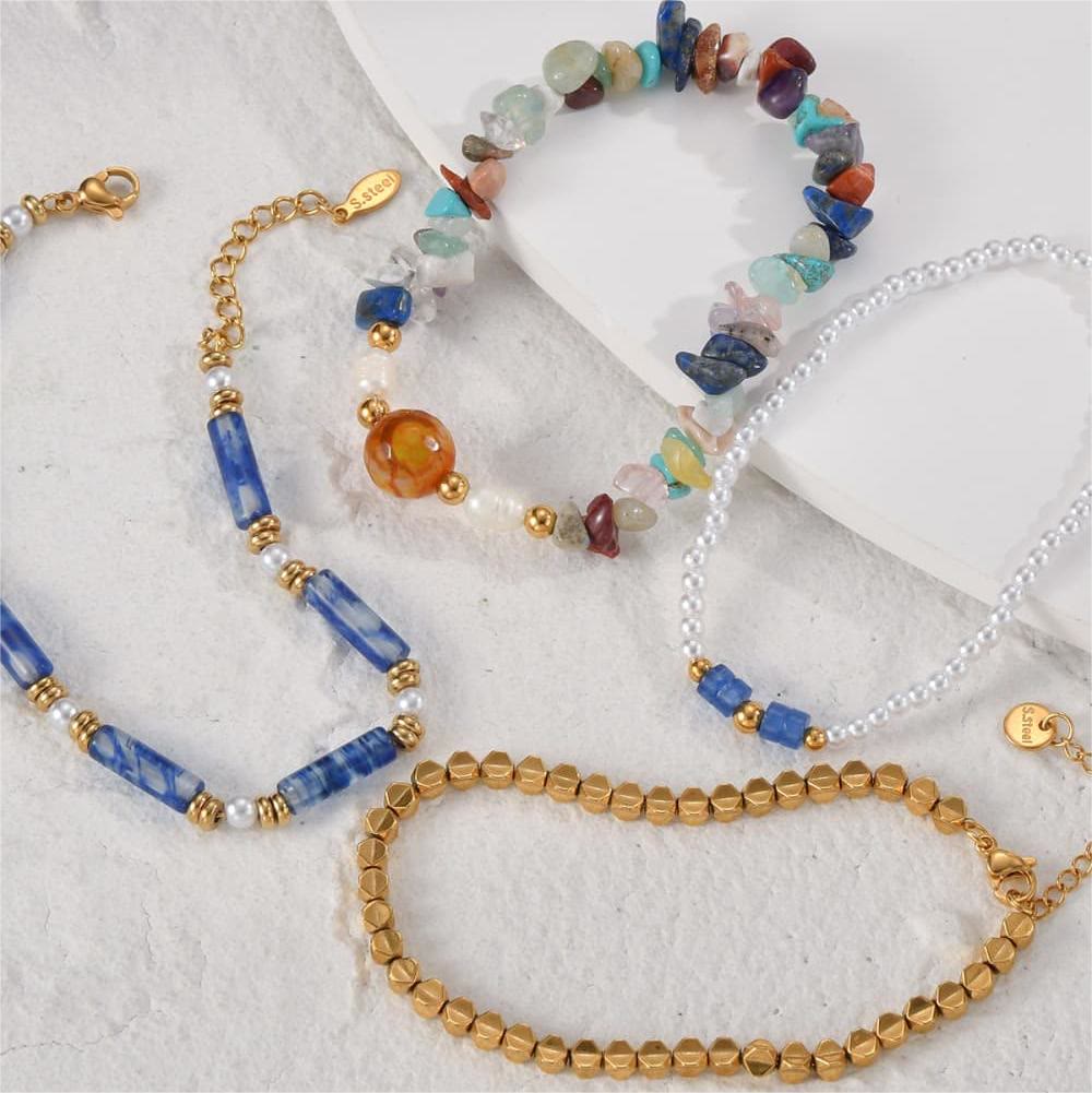 Ensemble de quatre bracelets en perles de cristal naturel Olivenorma