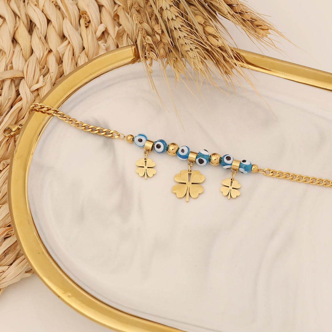 Bracelet porte-bonheur Olivenorma en époxy avec topaze bleue et trèfle mauvais œil