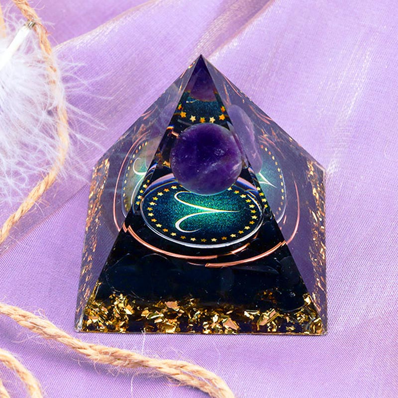 Sphère d'améthyste Olivenorma avec pyramide d'orgone du zodiaque Bélier en obsidienne