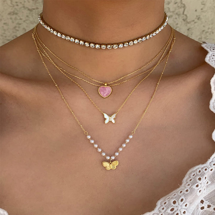 Collier en or cuivre plaqué avec papillon en coquillage naturel Olivenorma 