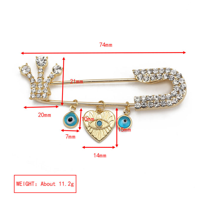 Broche en forme de cœur avec mauvais œil en zircon blanc Olivenorma 