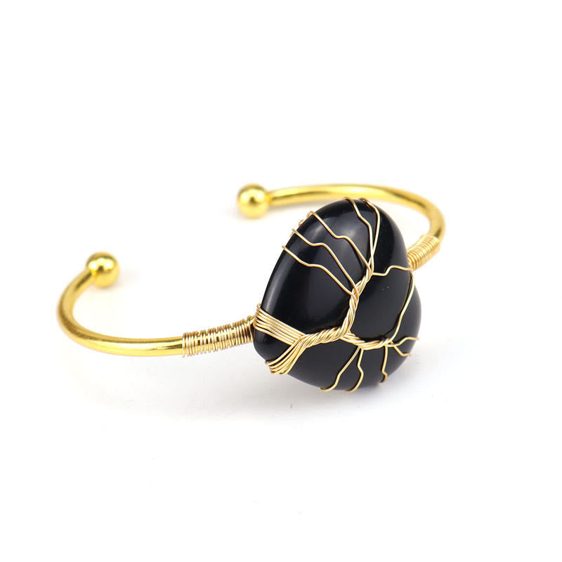 Bracelet en cristal naturel en forme de cœur enveloppé de fil de cuivre doré Olivenorma 