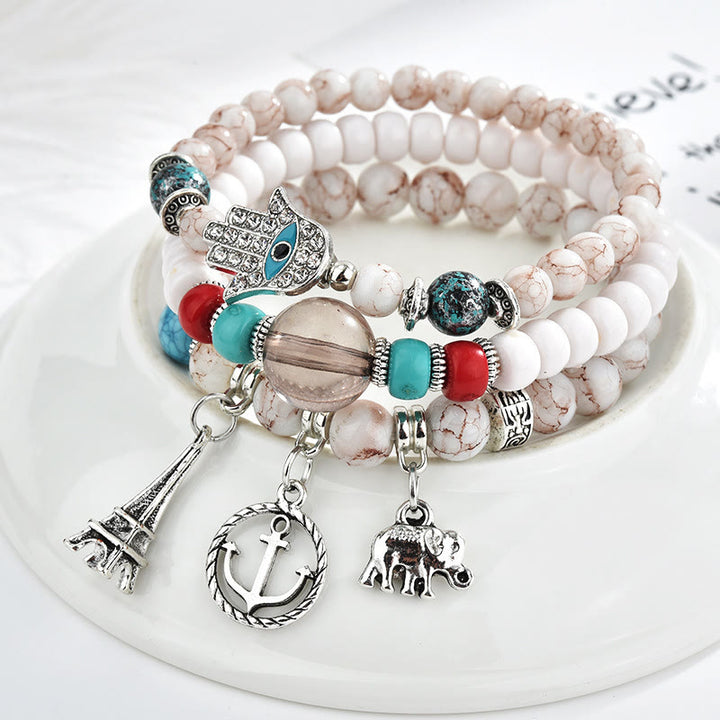 Ensemble de bracelets Hamsa contre le mauvais œil avec la tour de l'éléphant Olivenorma