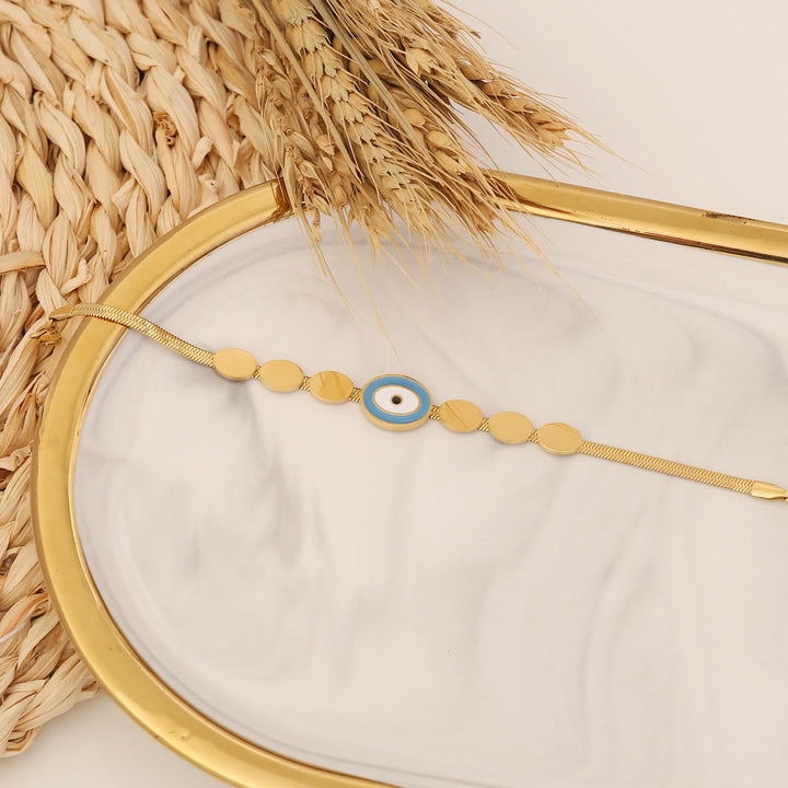 Bracelet porte-bonheur Olivenorma en époxy avec topaze bleue et trèfle mauvais œil