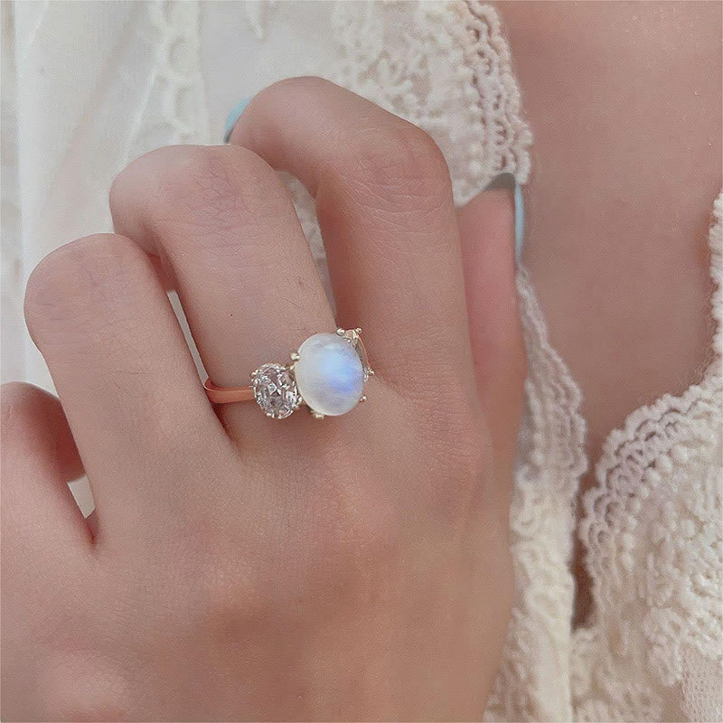 Bague en or rose avec trois diamants et pierre de lune et zircon blanc Olivenorma