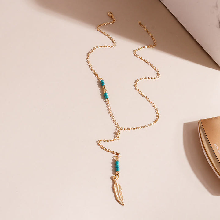 Collier bohème en argent et or avec pendentif en forme de feuille turquoise Olivenorma