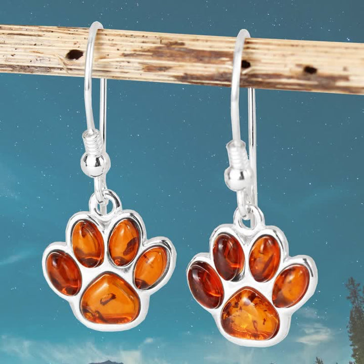 Boucles d'oreilles pendantes en ambre avec empreinte de patte de chien