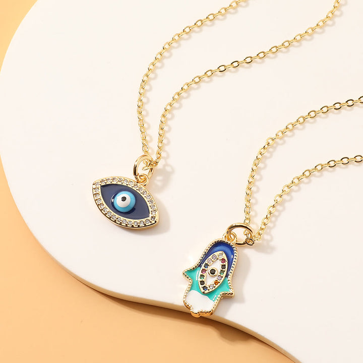 Collier en époxy en forme de cœur avec le mauvais œil Hamsa Olivenorma