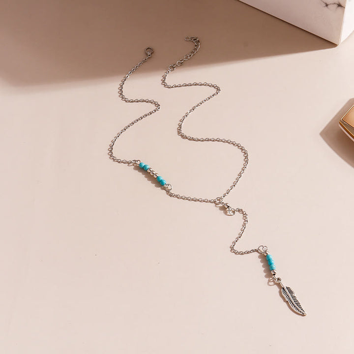 Collier bohème en argent et or avec pendentif en forme de feuille turquoise Olivenorma