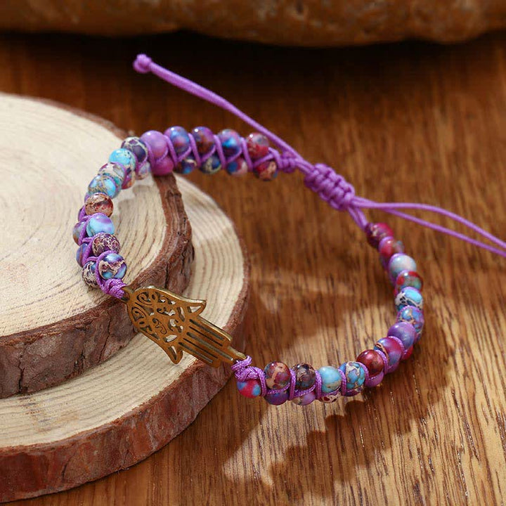 Le bracelet Hamsa en pierre violette de l'empereur de la conscience spirituelle