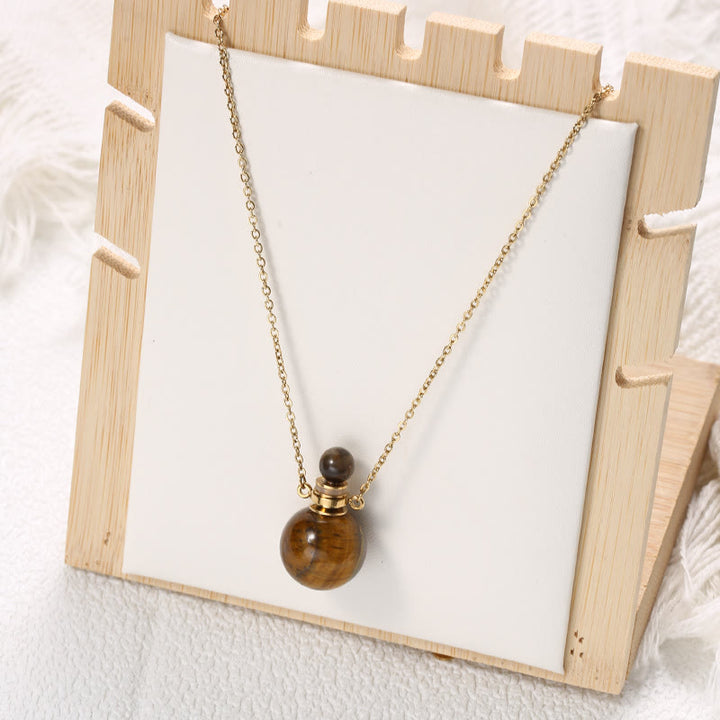 Collier pendentif bouteille de parfum en pierre ronde Olivenorma