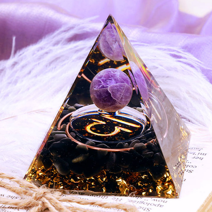 Sphère d'améthyste Olivenorma avec pyramide d'orgone du zodiaque Balance en obsidienne