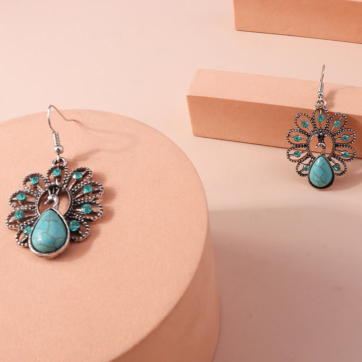 Boucles d'oreilles pendantes en forme de paon avec tourmaline paraiba turquoise Olivenorma