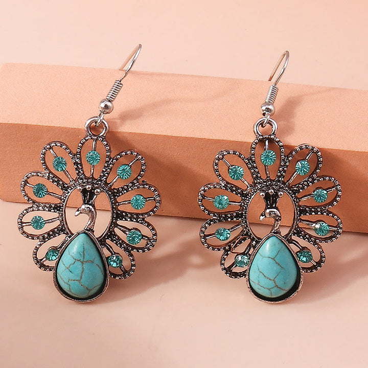 Boucles d'oreilles pendantes en forme de paon avec tourmaline paraiba turquoise Olivenorma