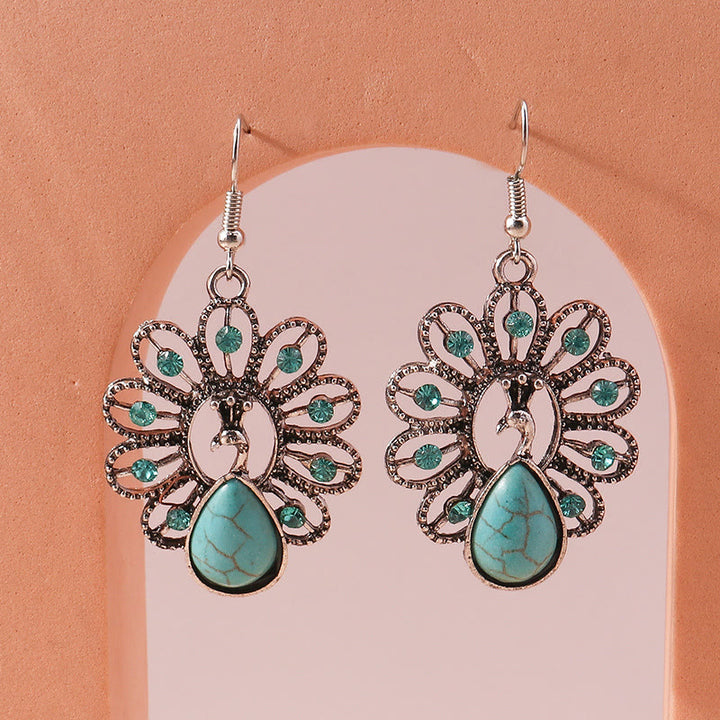 Boucles d'oreilles pendantes en forme de paon avec tourmaline paraiba turquoise Olivenorma