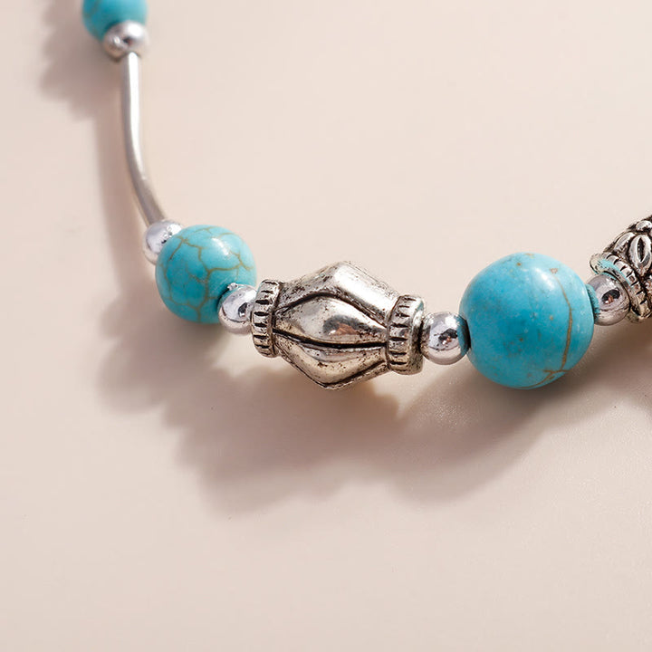 Bracelet pendentif croix en argent et perles turquoise Olivenorma