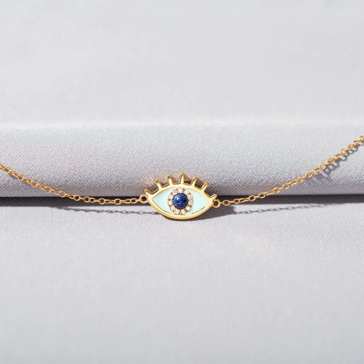 Bracelet fin en or et zircone contre le mauvais œil Olivenorma « SAFE &amp; PROTECTED »