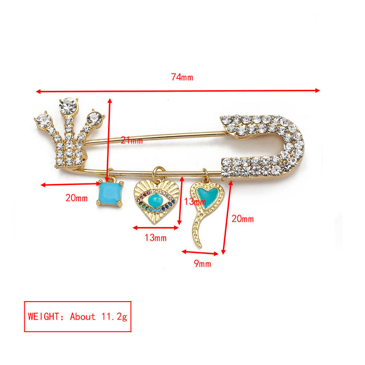 Broche en forme de cœur avec mauvais œil en zircon blanc Olivenorma 