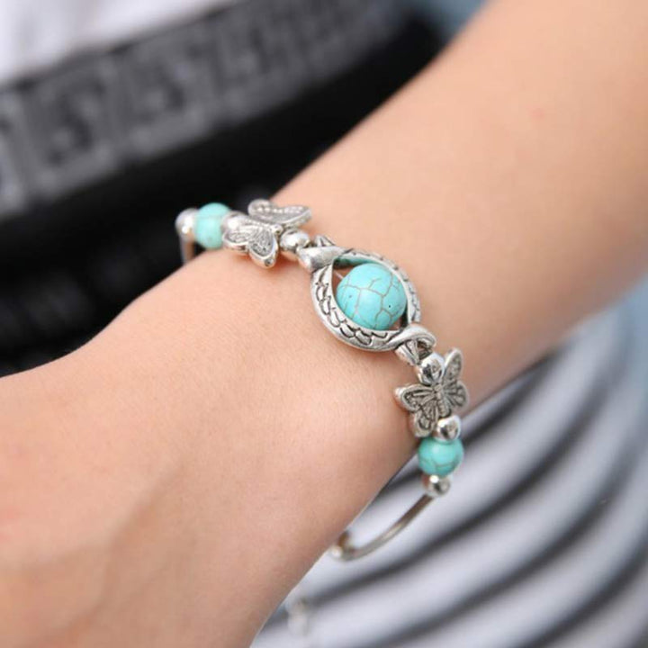 Bracelet papillon en sphère turquoise Olivenorma