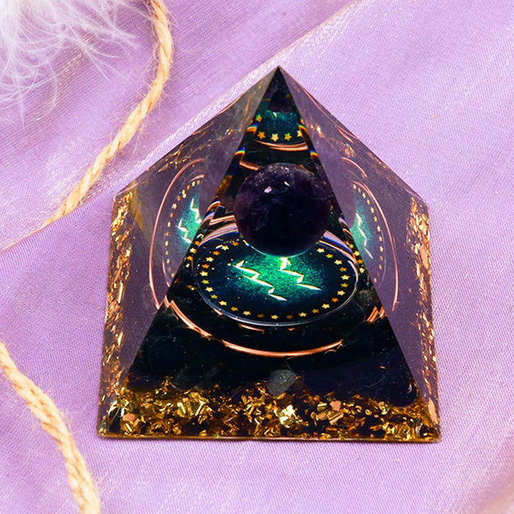 Sphère d'améthyste Olivenorma avec pyramide d'orgone du zodiaque Verseau en obsidienne 