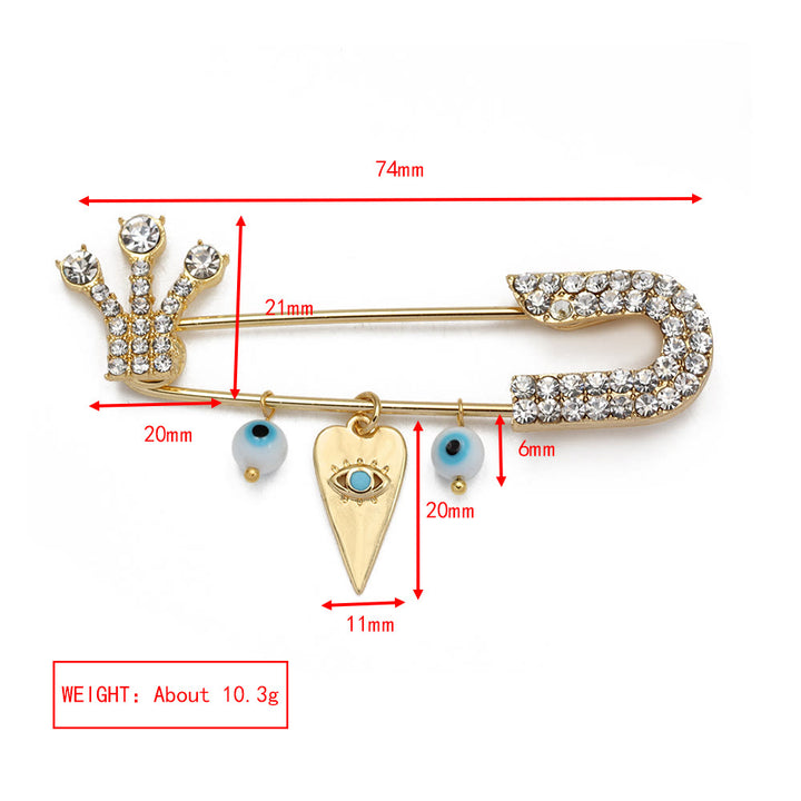 Broche en forme de cœur avec mauvais œil en zircon blanc Olivenorma 