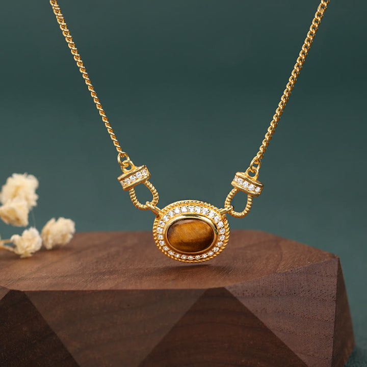 Collier rétro en pierre œil de tigre Olivenorma « Le livre de la galaxie »