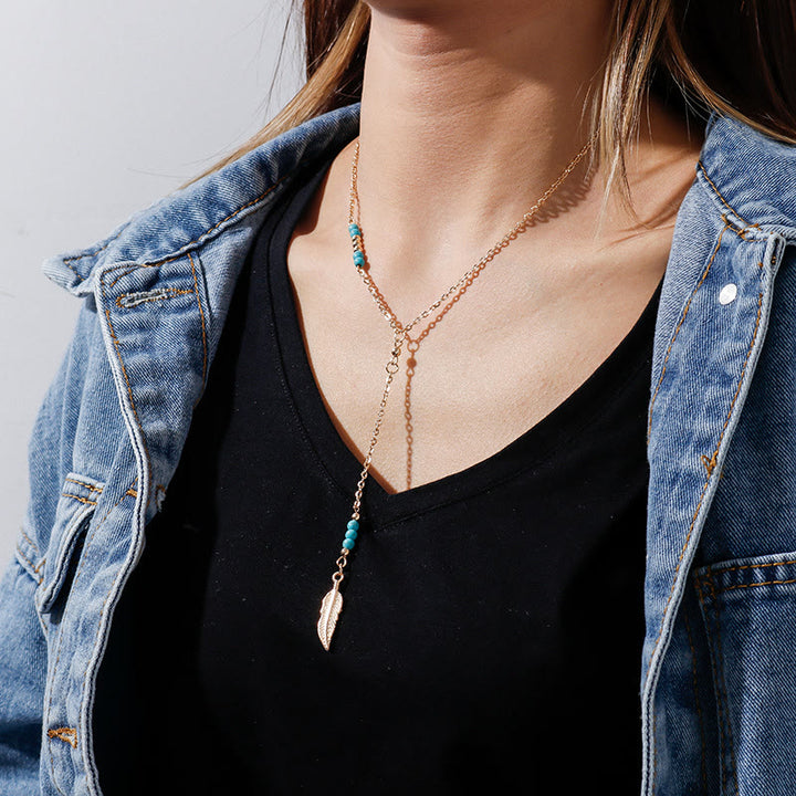 Collier bohème en argent et or avec pendentif en forme de feuille turquoise Olivenorma