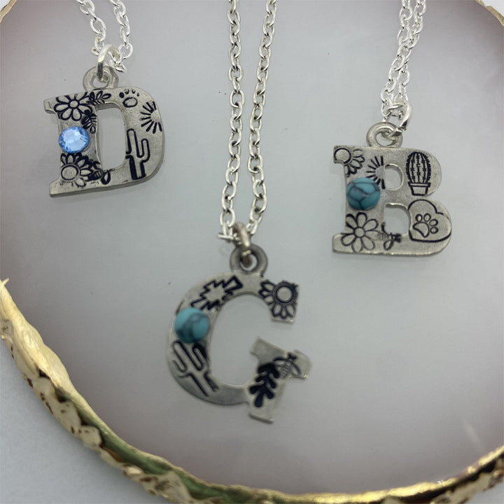 Collier avec initiale gravée en turquoise naturelle Olivenorma